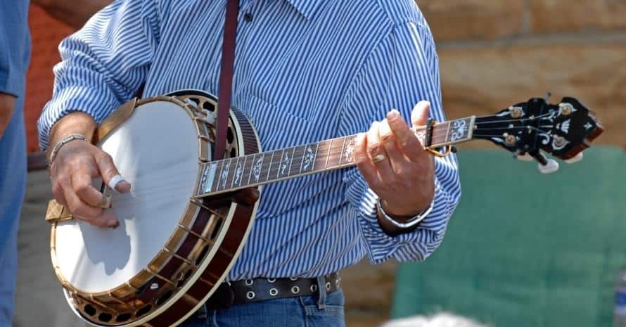Man in shirt playing banjo